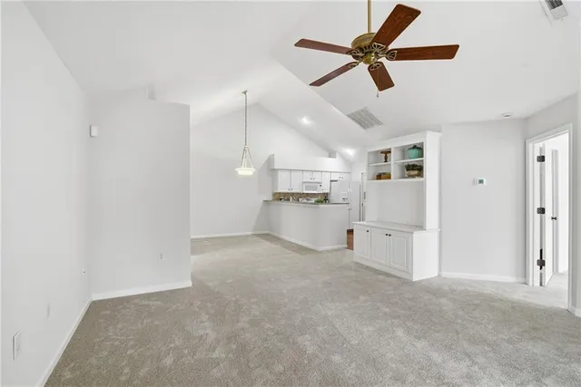 a view of a kitchen with a sink and cabinets