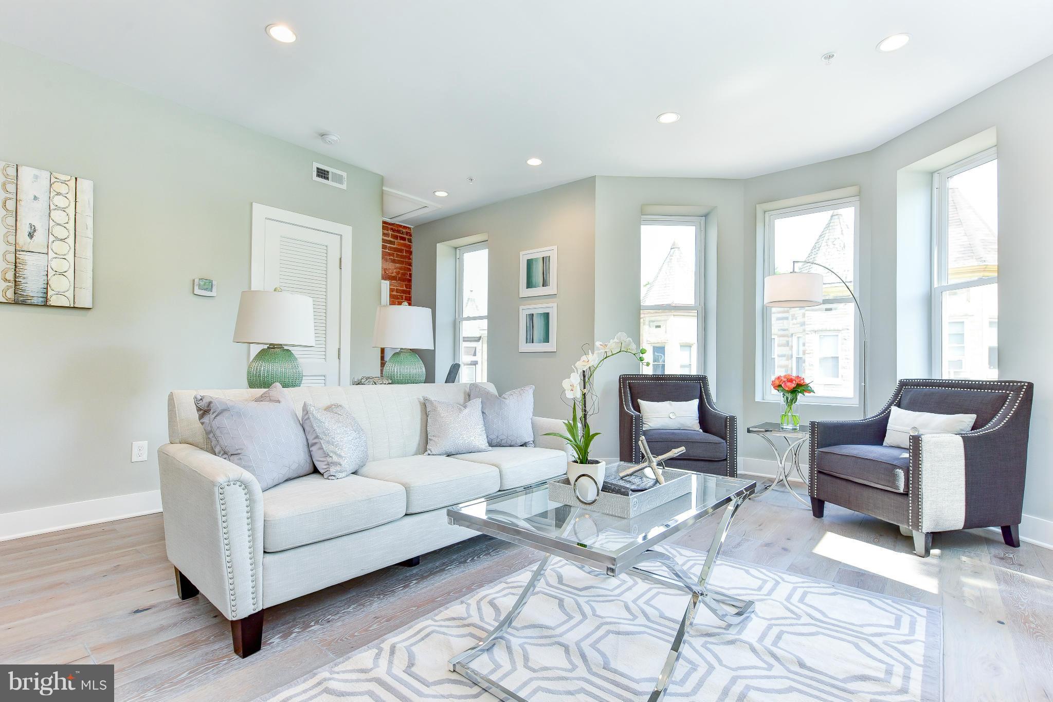 37 Todd Place Northeast, Unit 2 Washington, DC 20002 - Photo 2 of 21 a living room with furniture and a large window