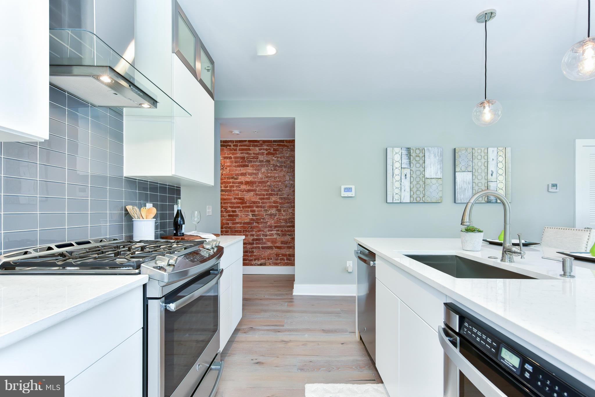 37 Todd Place Northeast, Unit 2 Washington, DC 20002 - Photo 12 of 21 a kitchen that has a sink and a stove