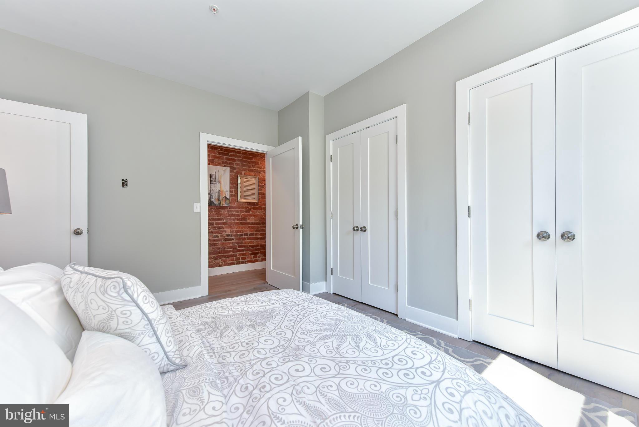 37 Todd Place Northeast, Unit 2 Washington, DC 20002 - Photo 15 of 21 a bedroom with a bed and a window