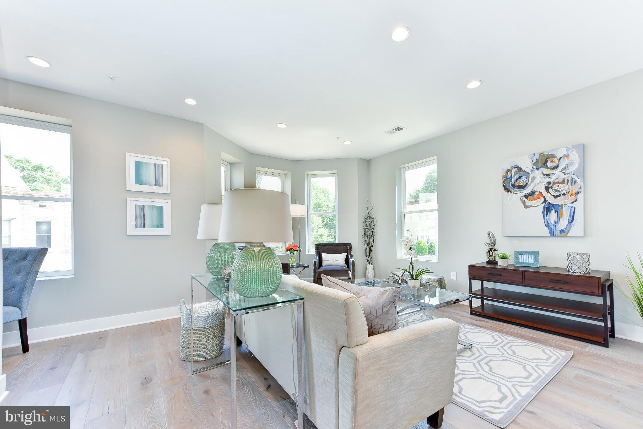 37 Todd Place Northeast, Unit 2 Washington, DC 20002 - Photo 3 of 21 a living room with furniture and a potted plant