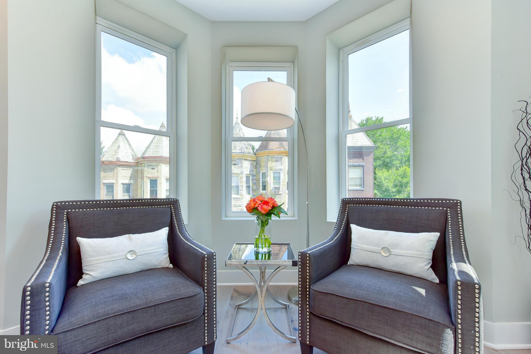 37 Todd Place Northeast, Unit 2 Washington, DC 20002 - Photo 4 of 21 a living room with a couch and a window