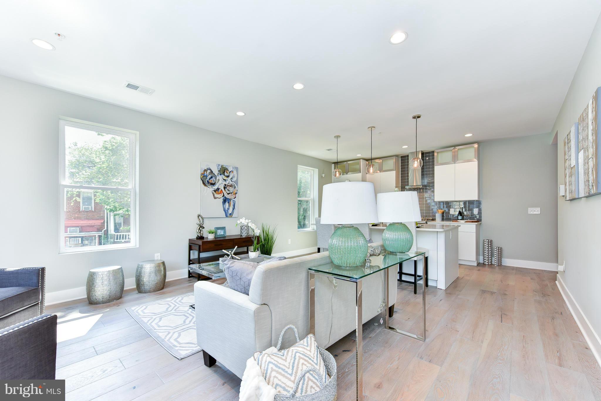 37 Todd Place Northeast, Unit 2 Washington, DC 20002 - Photo 5 of 21 a living room with furniture and a large window