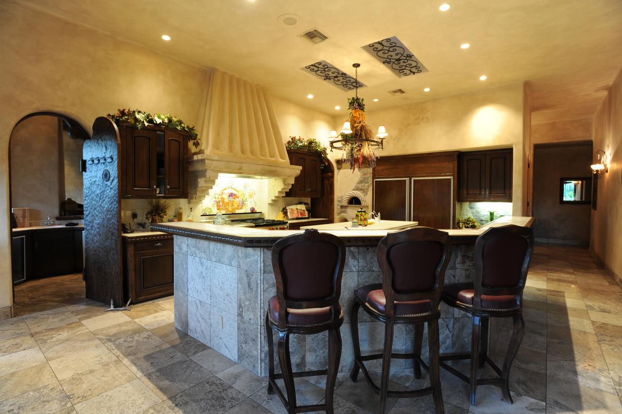 4811 East Pebble Ridge Road Paradise Valley, AZ 85253 - Photo 5 of 20 a kitchen with a table and chairs in it