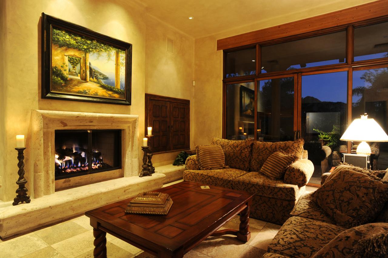 4811 East Pebble Ridge Road Paradise Valley, AZ 85253 - Photo 6 of 20 a living room with furniture a flat screen tv and a fireplace