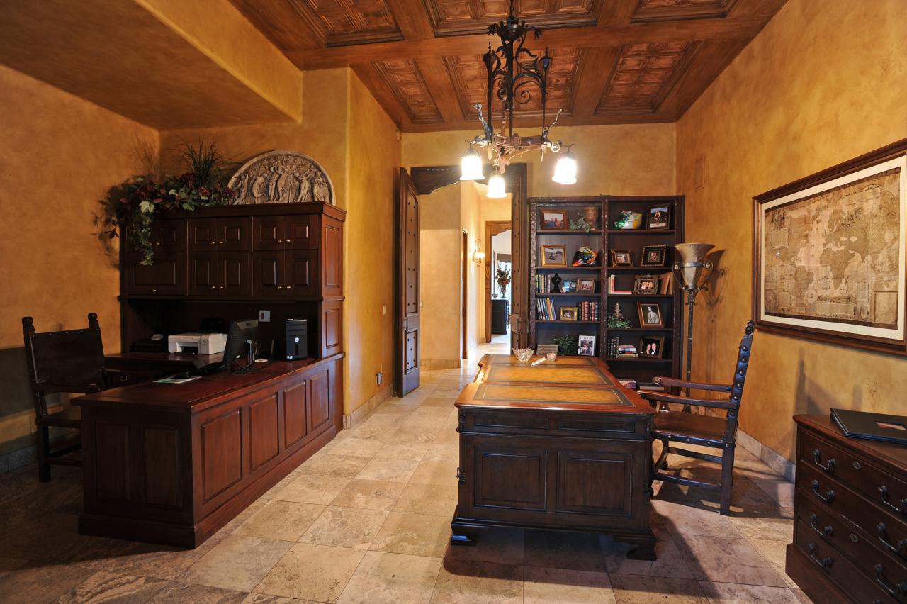 4811 East Pebble Ridge Road Paradise Valley, AZ 85253 - Photo 9 of 20 a room with lots of wooden furniture and a chandelier