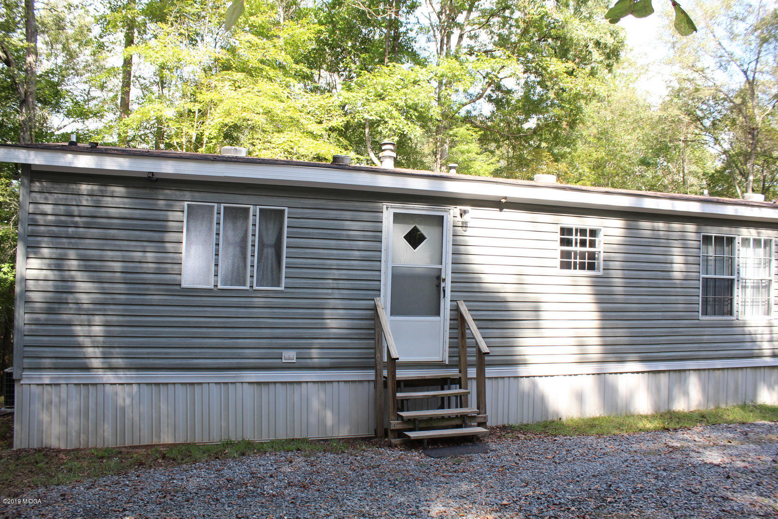 10094 Zebulon Road Forsyth, GA 31029 - Photo 20 of 20 a front view of a house with a yard