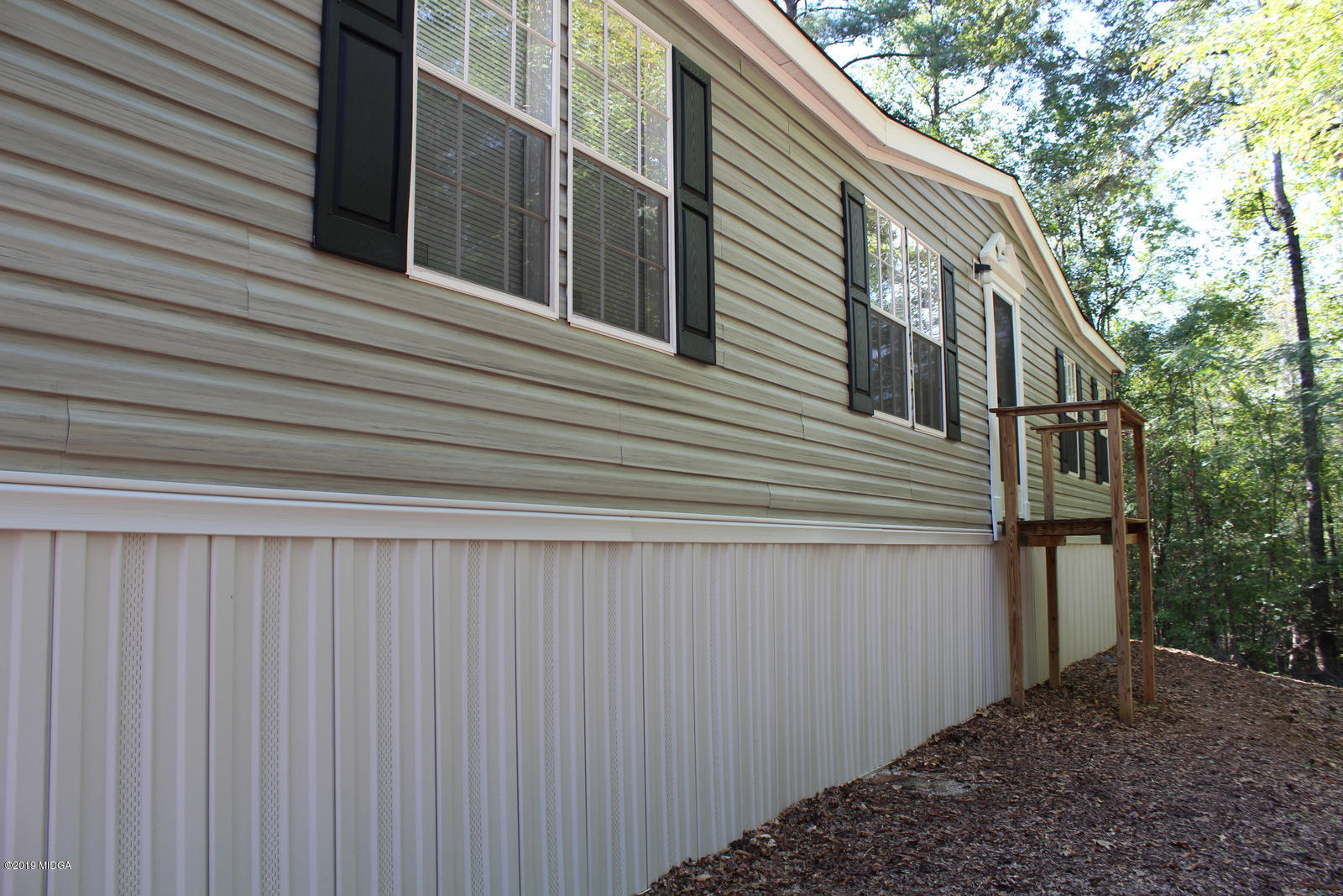 10094 Zebulon Road Forsyth, GA 31029 - Photo 3 of 20 a view of a house with a large window