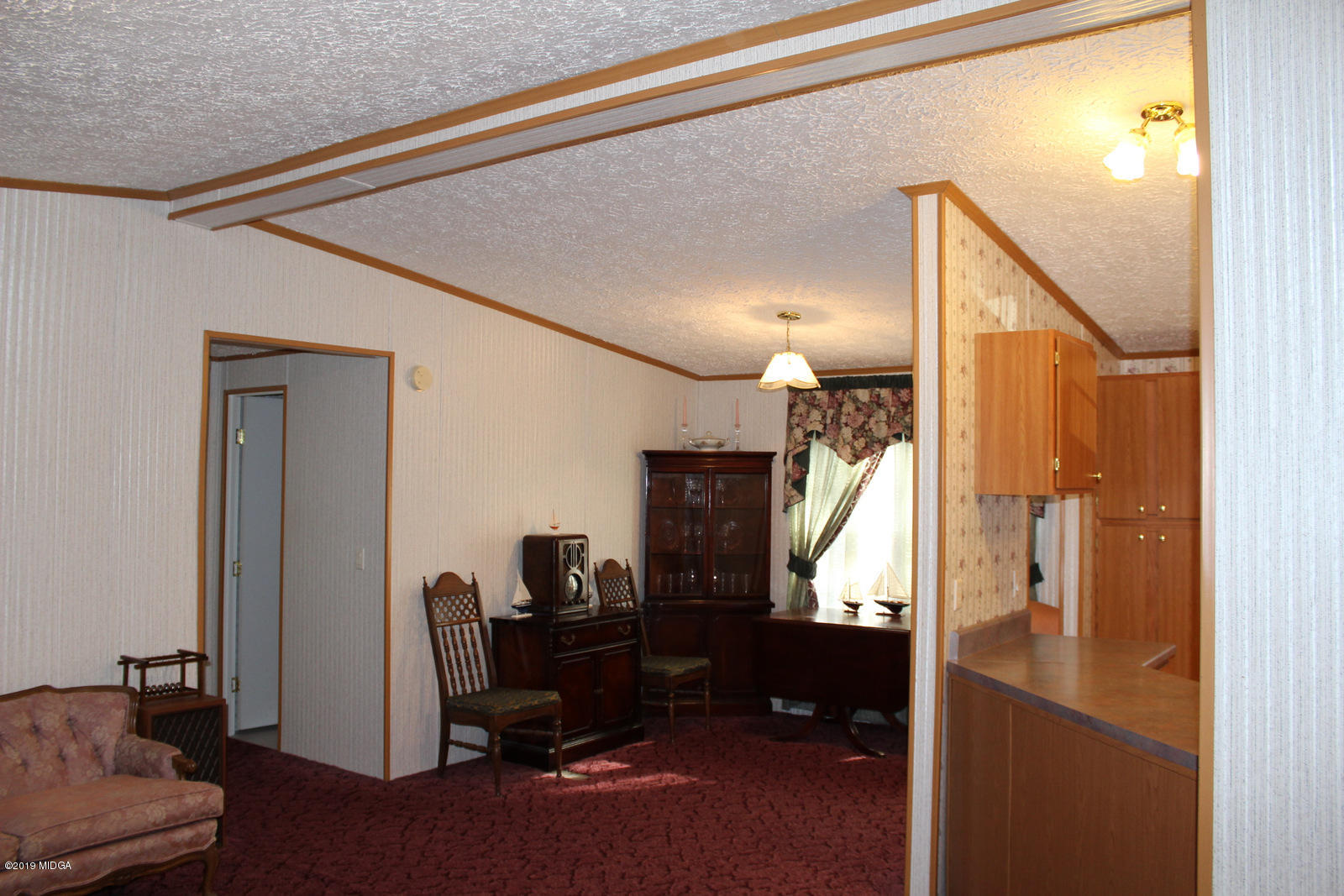 10094 Zebulon Road Forsyth, GA 31029 - Photo 5 of 20 a view of a hallway with workspace