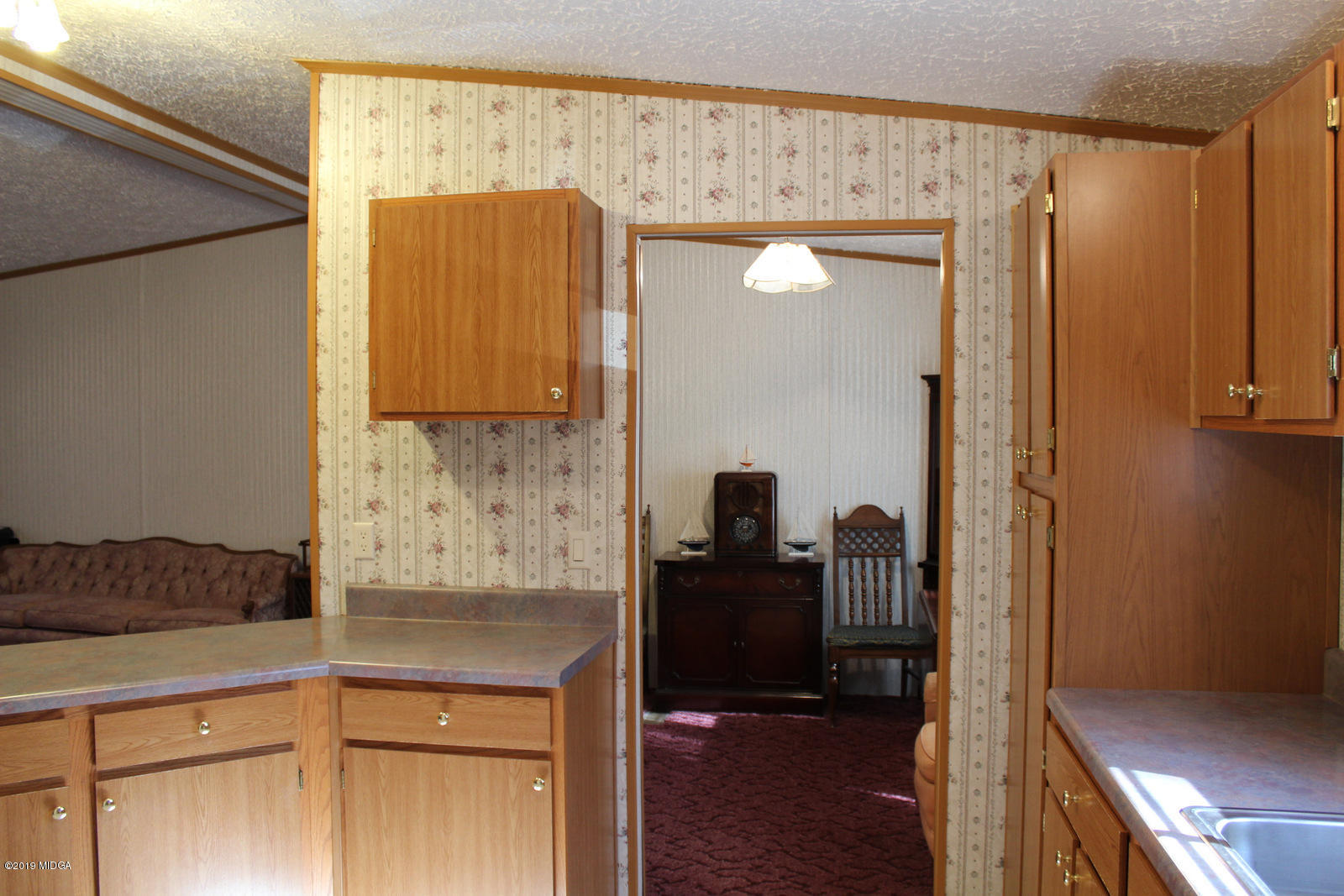 10094 Zebulon Road Forsyth, GA 31029 - Photo 8 of 20 a kitchen with a refrigerator and a stove