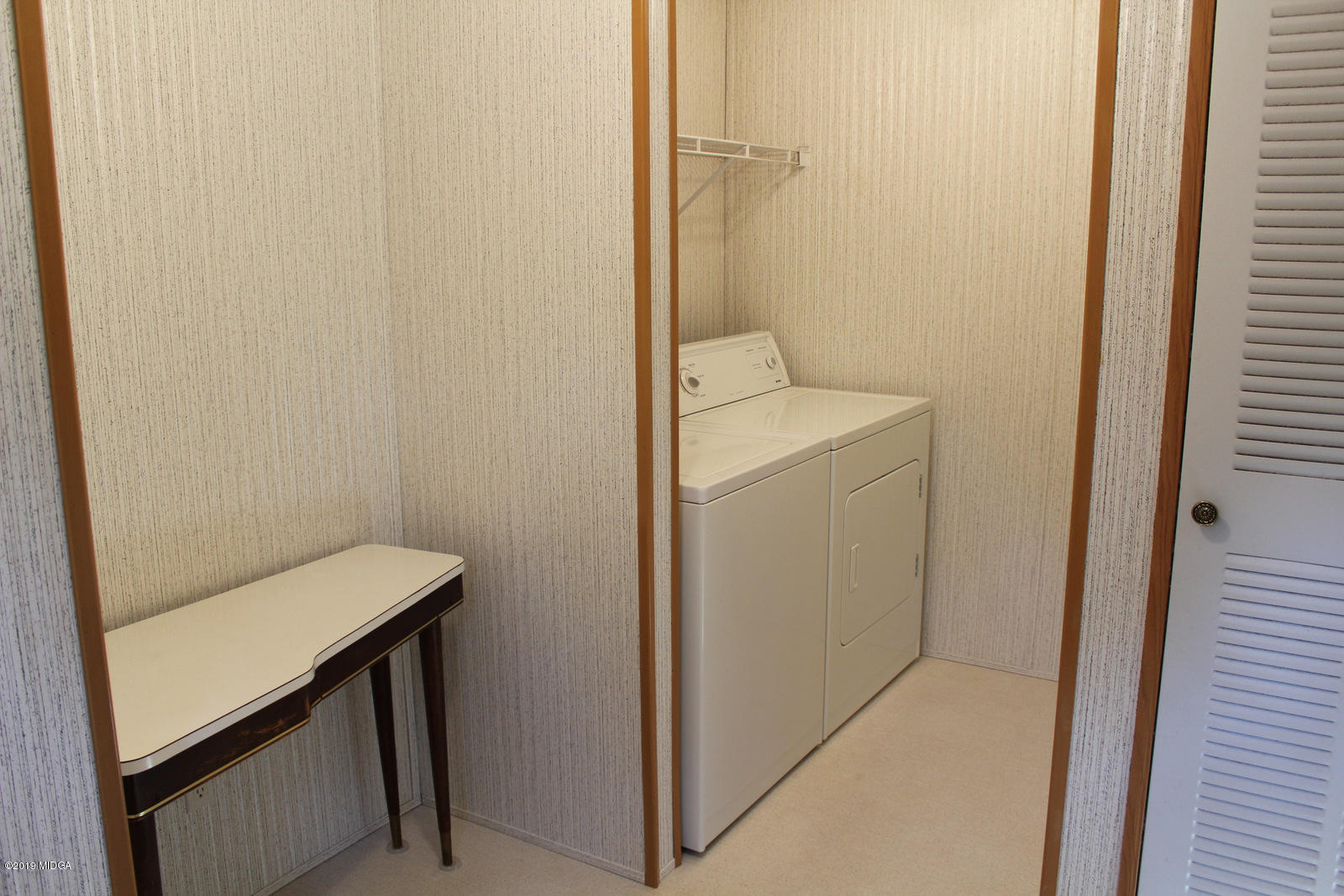 10094 Zebulon Road Forsyth, GA 31029 - Photo 10 of 20 a view of bathroom with a sink and a washer