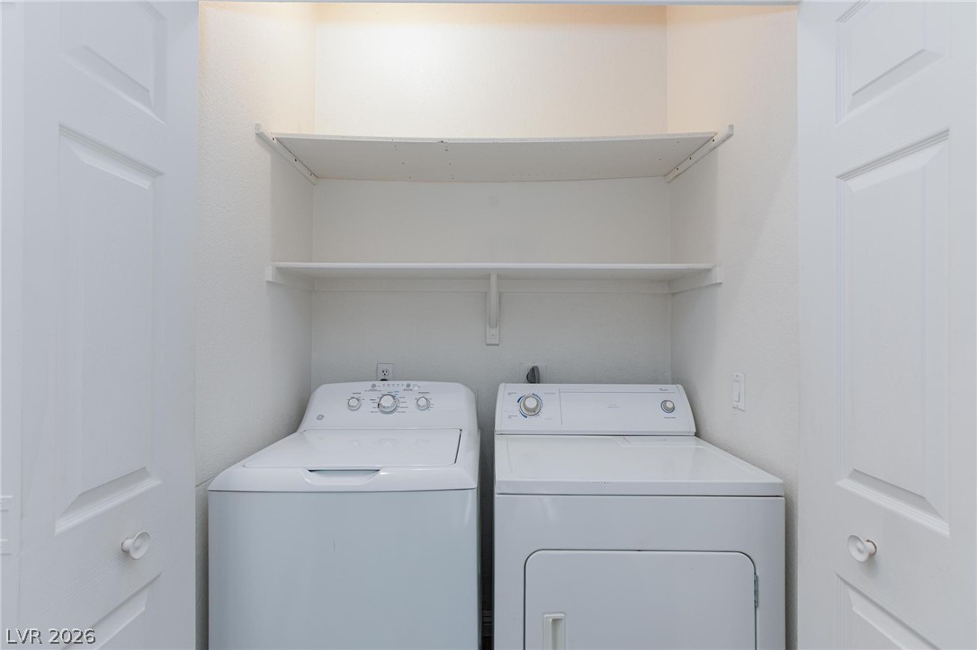 2246 Ramsgate Drive Henderson, NV 89074 - Photo 26 of 36 A well-appointed laundry area offers convenient household utility with shelving for organization.