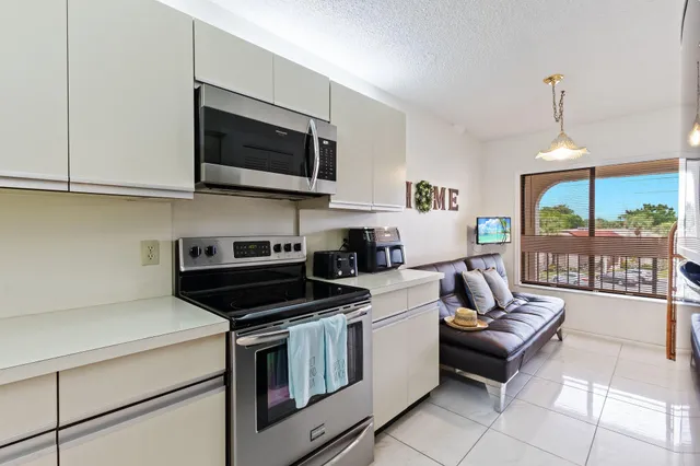 a kitchen with a stove and a microwave