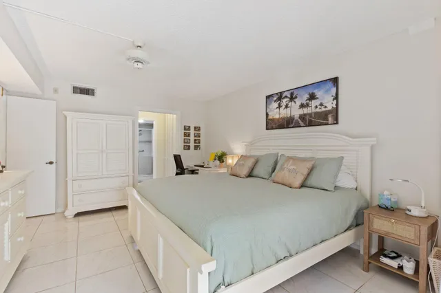 a bedroom with a bed and a cabinets