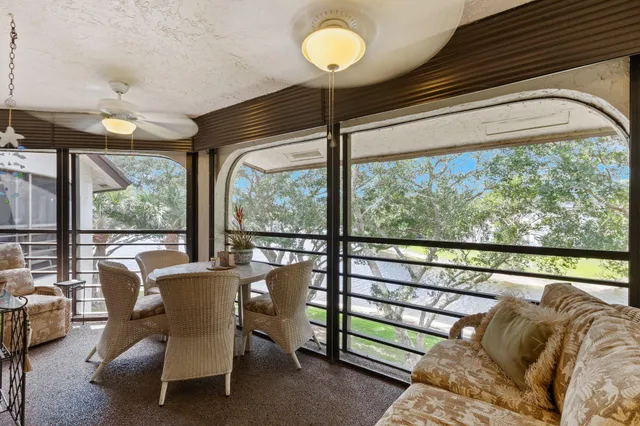 a view of a room with furniture and a window