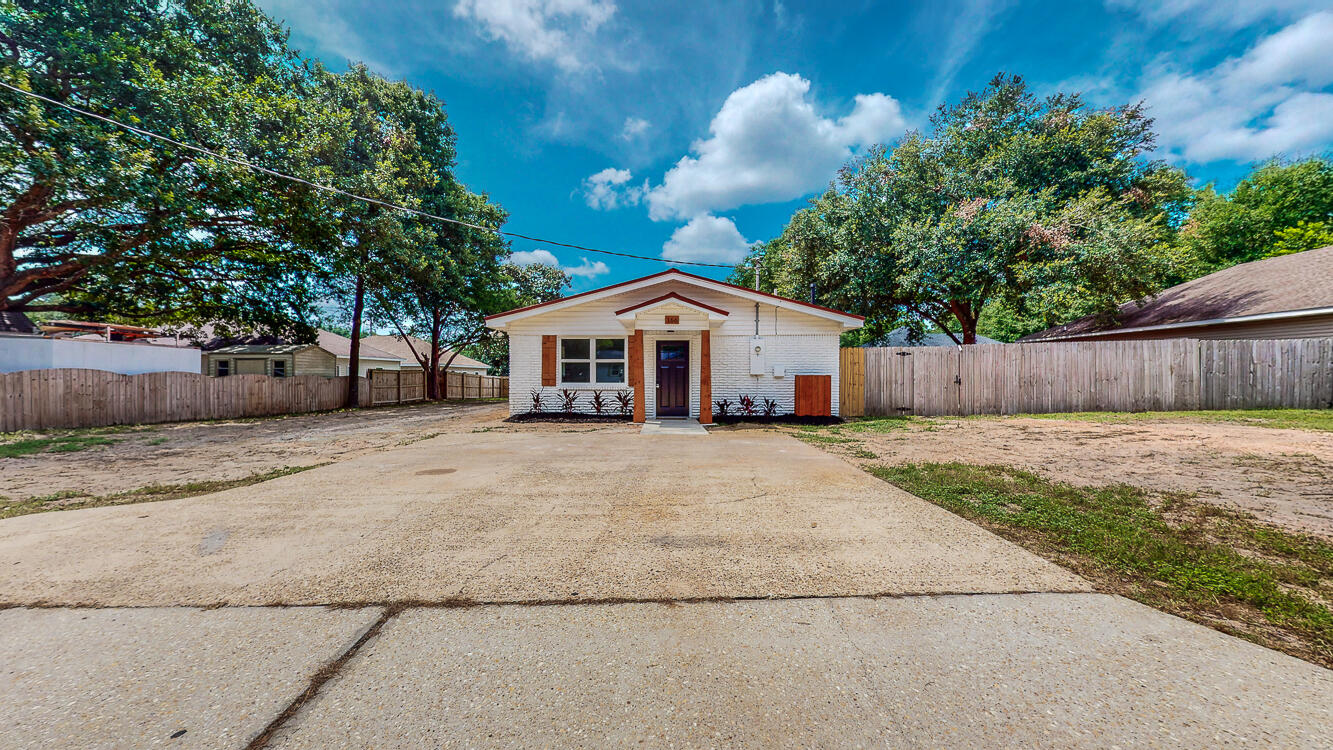 166 Patch Avenue Crestview, FL 32539 - Photo 11 of 48 a front view of a house with a yard