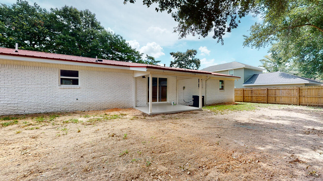 166 Patch Avenue Crestview, FL 32539 - Photo 13 of 48 a view of an house with backyard space and balcony