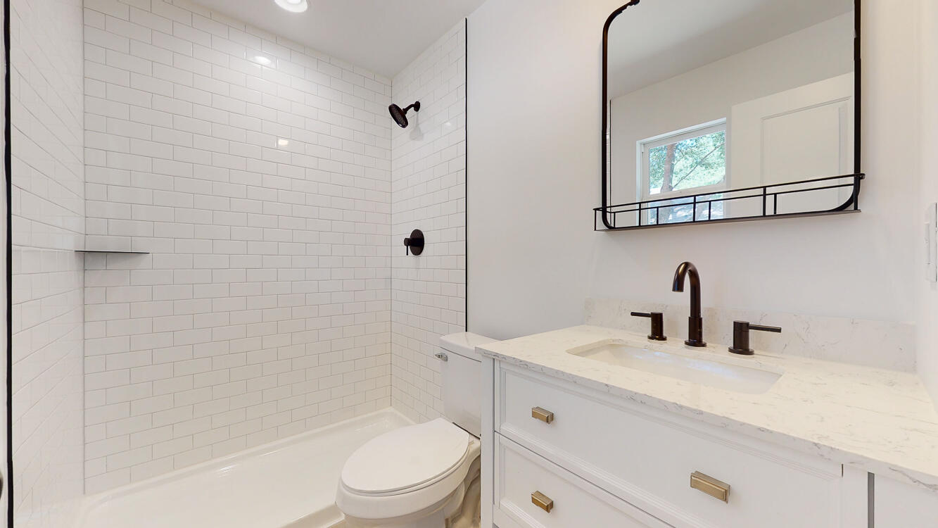 166 Patch Avenue Crestview, FL 32539 - Photo 16 of 48 a bathroom with a sink a toilet and shower