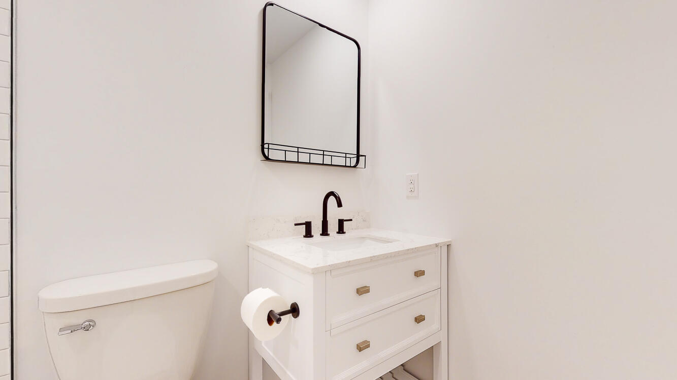 166 Patch Avenue Crestview, FL 32539 - Photo 18 of 48 a bathroom with a sink a toilet and mirror