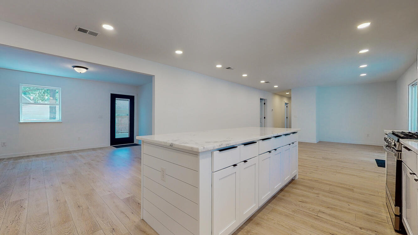 166 Patch Avenue Crestview, FL 32539 - Photo 27 of 48 a kitchen with granite countertop a stove and a sink