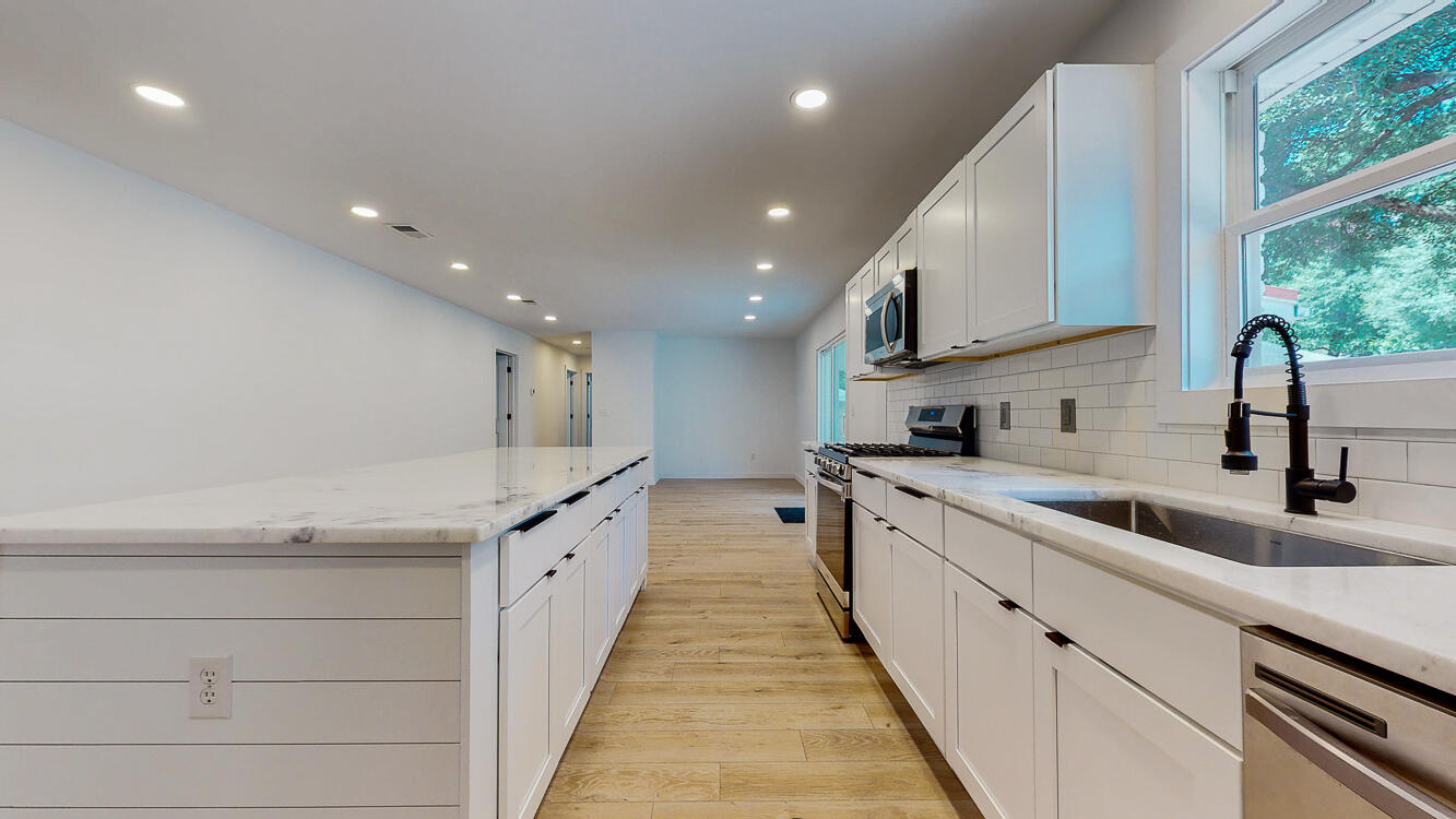 166 Patch Avenue Crestview, FL 32539 - Photo 28 of 48 a large kitchen with stainless steel appliances a sink and a large window