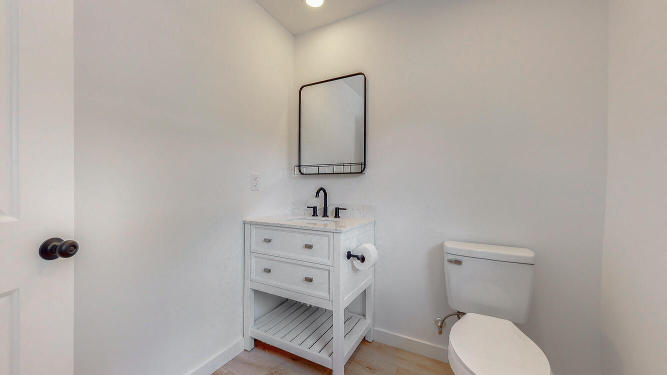 166 Patch Avenue Crestview, FL 32539 - Photo 32 of 48 a bathroom with a toilet a sink and mirror