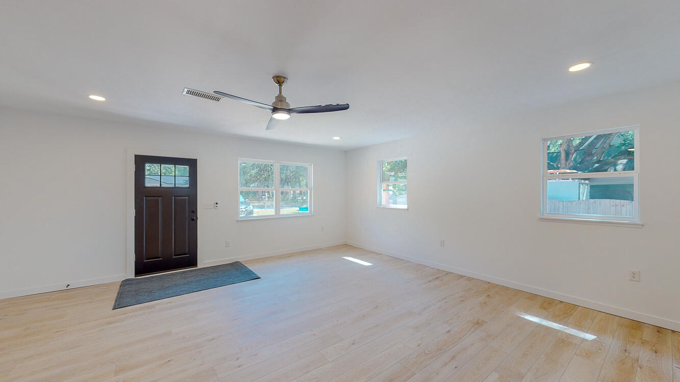 166 Patch Avenue Crestview, FL 32539 - Photo 34 of 48 an empty room with windows and ceiling fan