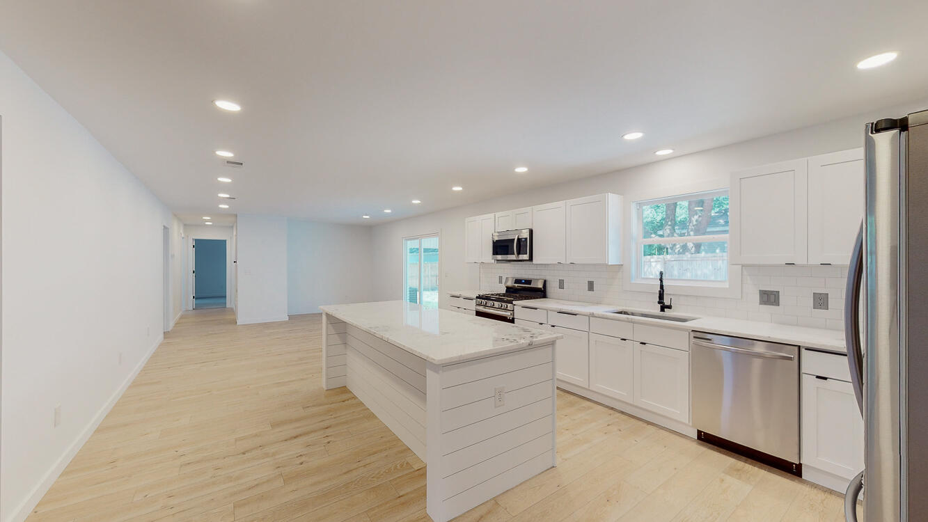 166 Patch Avenue Crestview, FL 32539 - Photo 36 of 48 a large white kitchen with a sink stove and refrigerator
