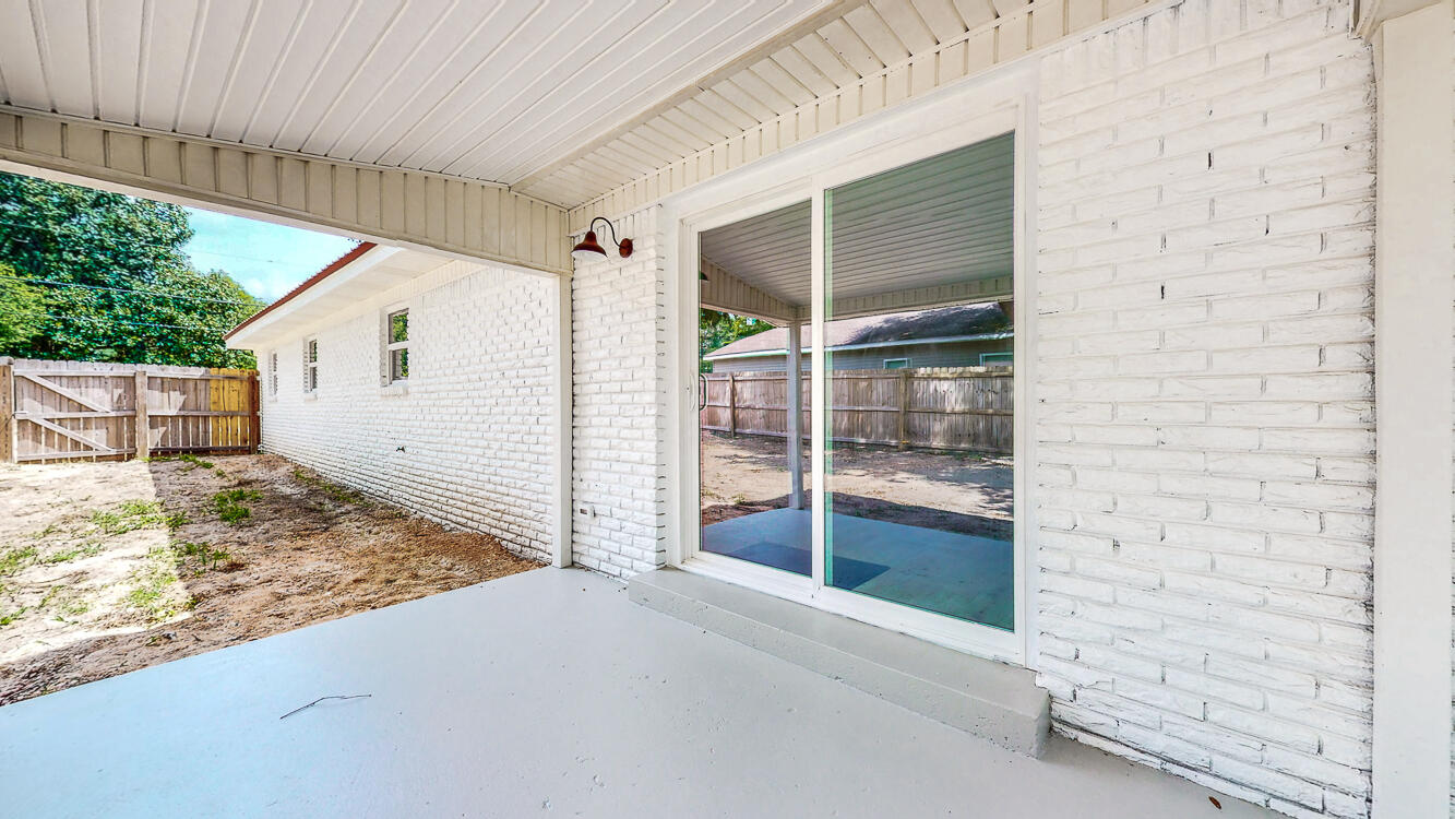 166 Patch Avenue Crestview, FL 32539 - Photo 7 of 48 a view of house with wooden floor and a yard
