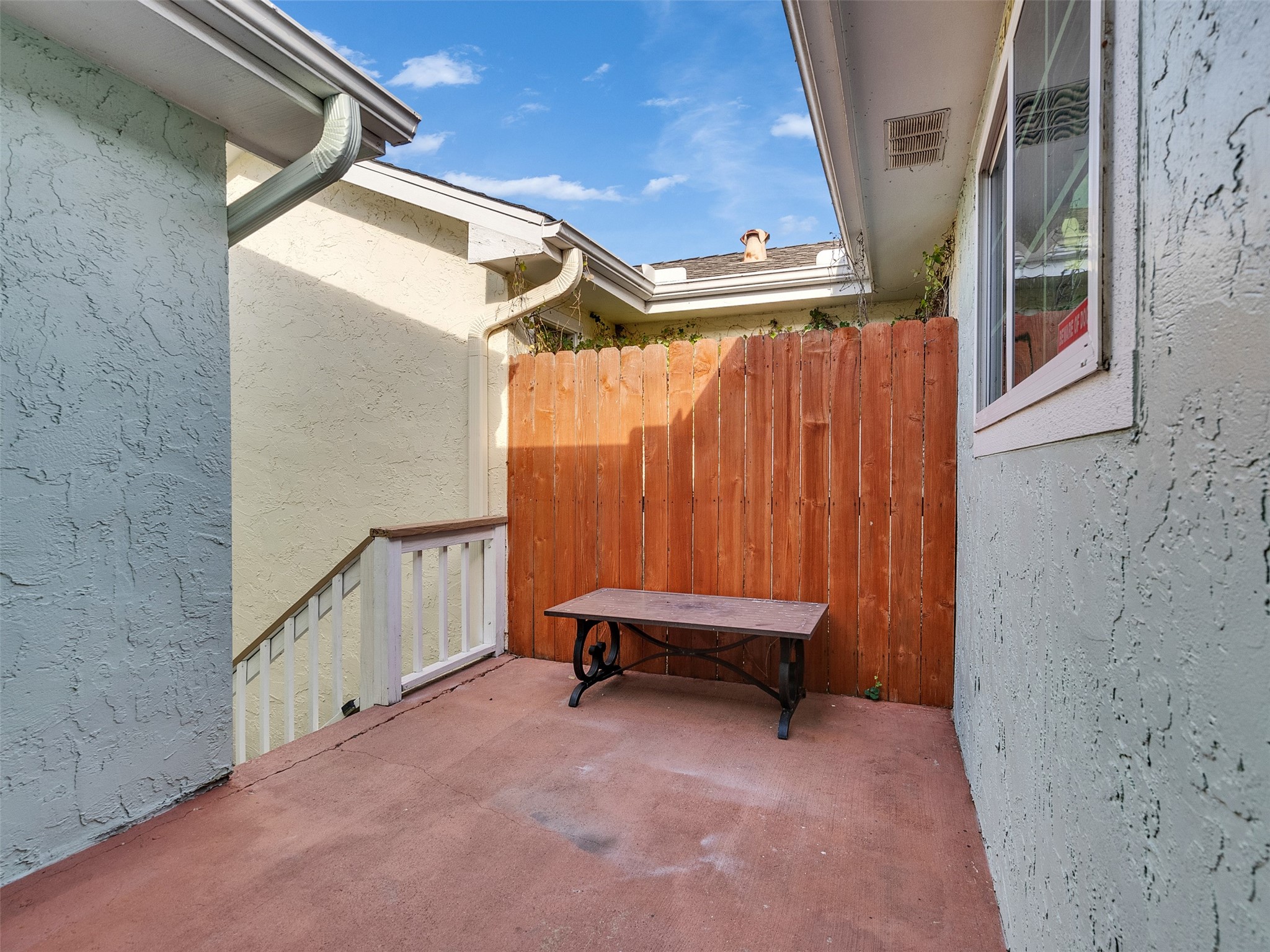10109 Schaper Road Galveston, TX 77554 - Photo 17 of 33 Gated side entrance from the garage offers easy, secure access. Convenience meets functionality—perfect for busy lifestyles!