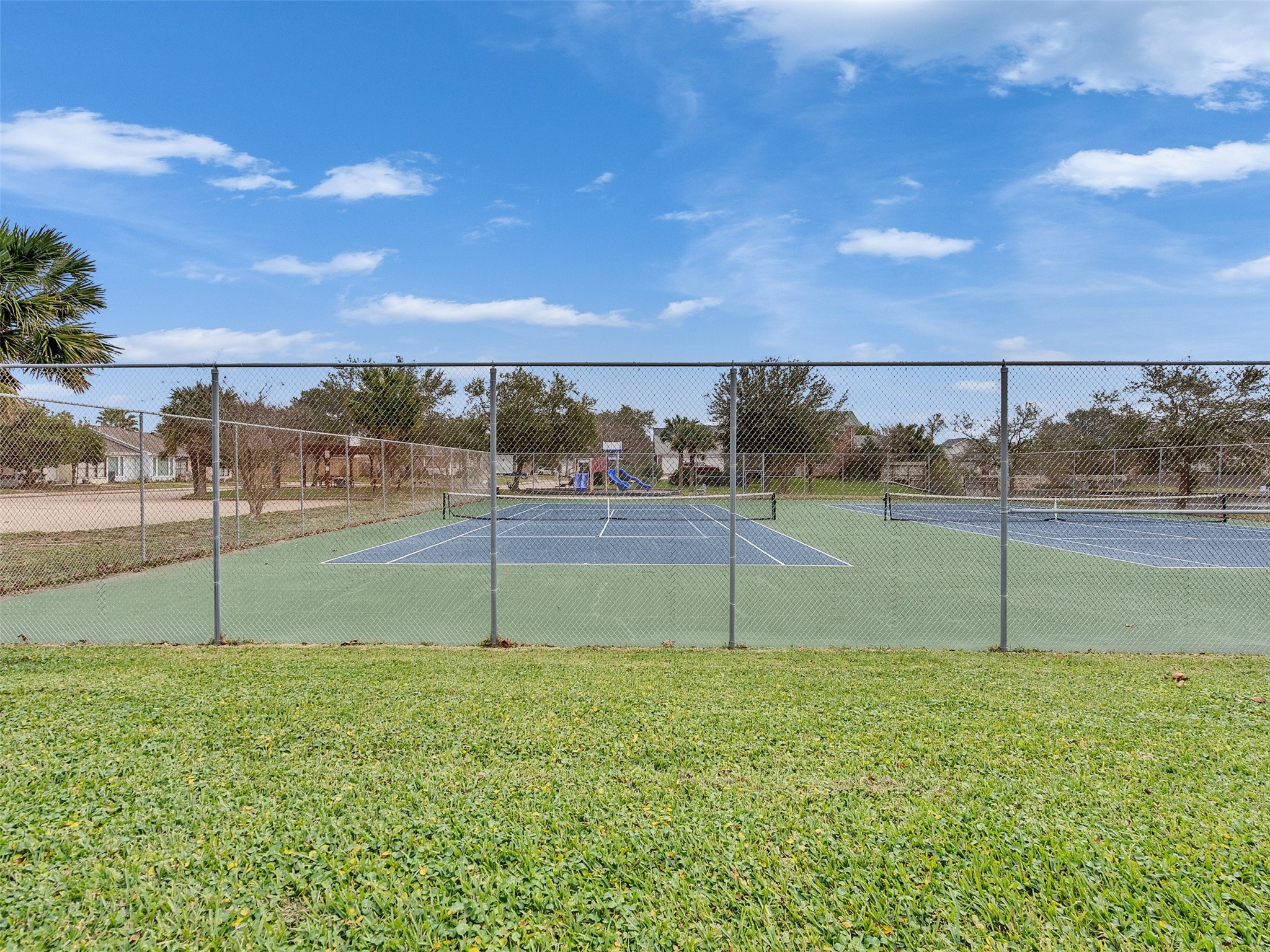 10109 Schaper Road Galveston, TX 77554 - Photo 25 of 33 Community tennis courts offering a fun and active lifestyle right in the neighborhood.