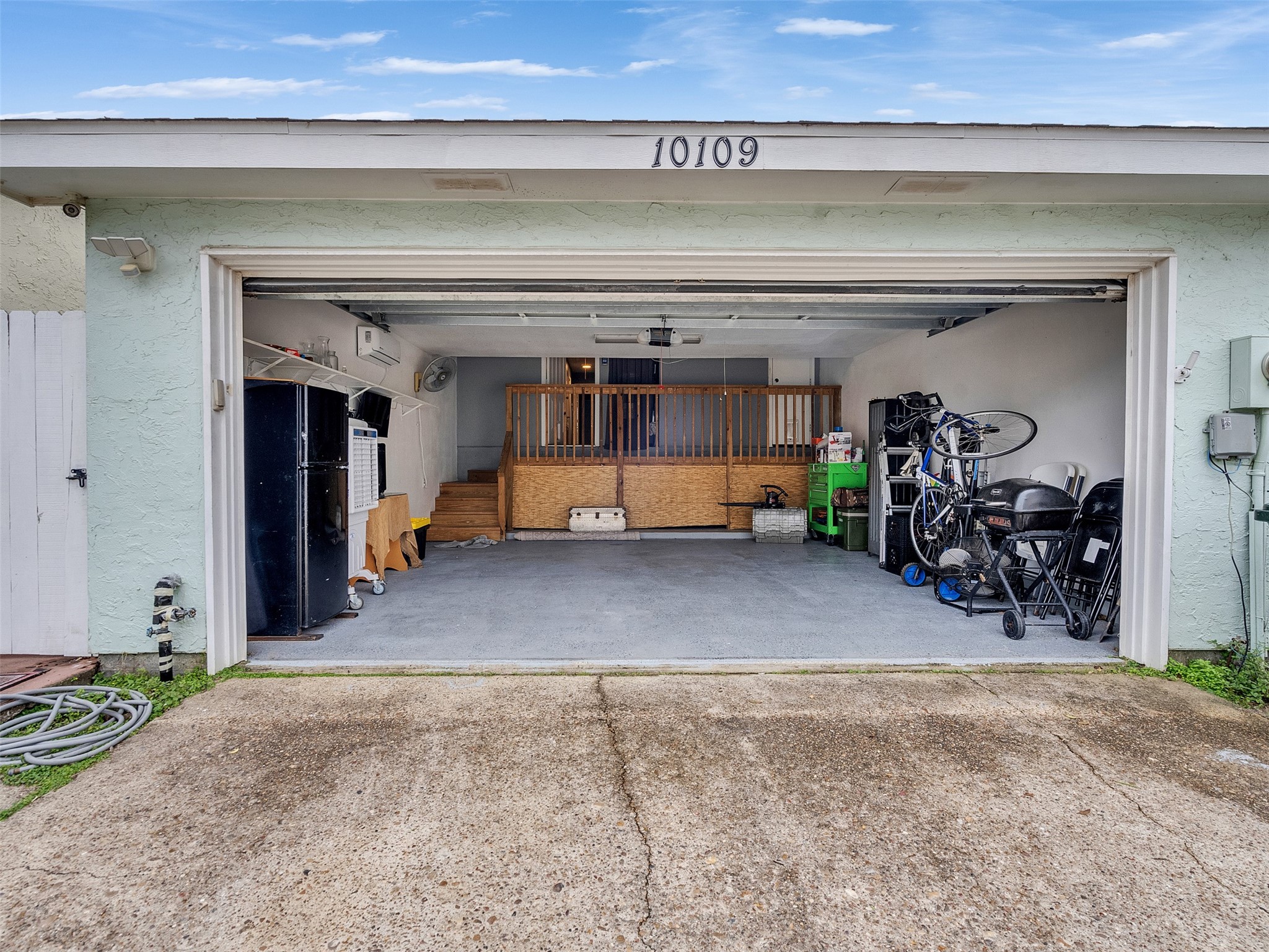 10109 Schaper Road Galveston, TX 77554 - Photo 29 of 33 DOUBLE CAR GARAGE with extra storage and AC mini split, ideal for a man cave, gym, or workshop.