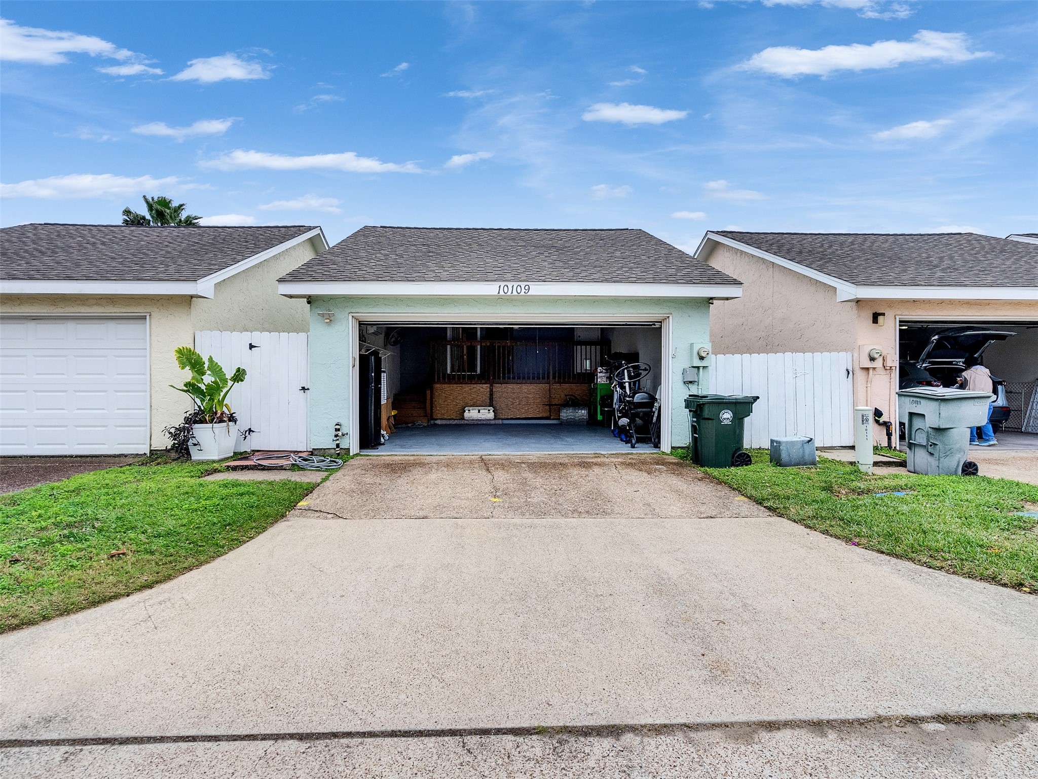 10109 Schaper Road Galveston, TX 77554 - Photo 30 of 33 a view of a house with a yard and a garage