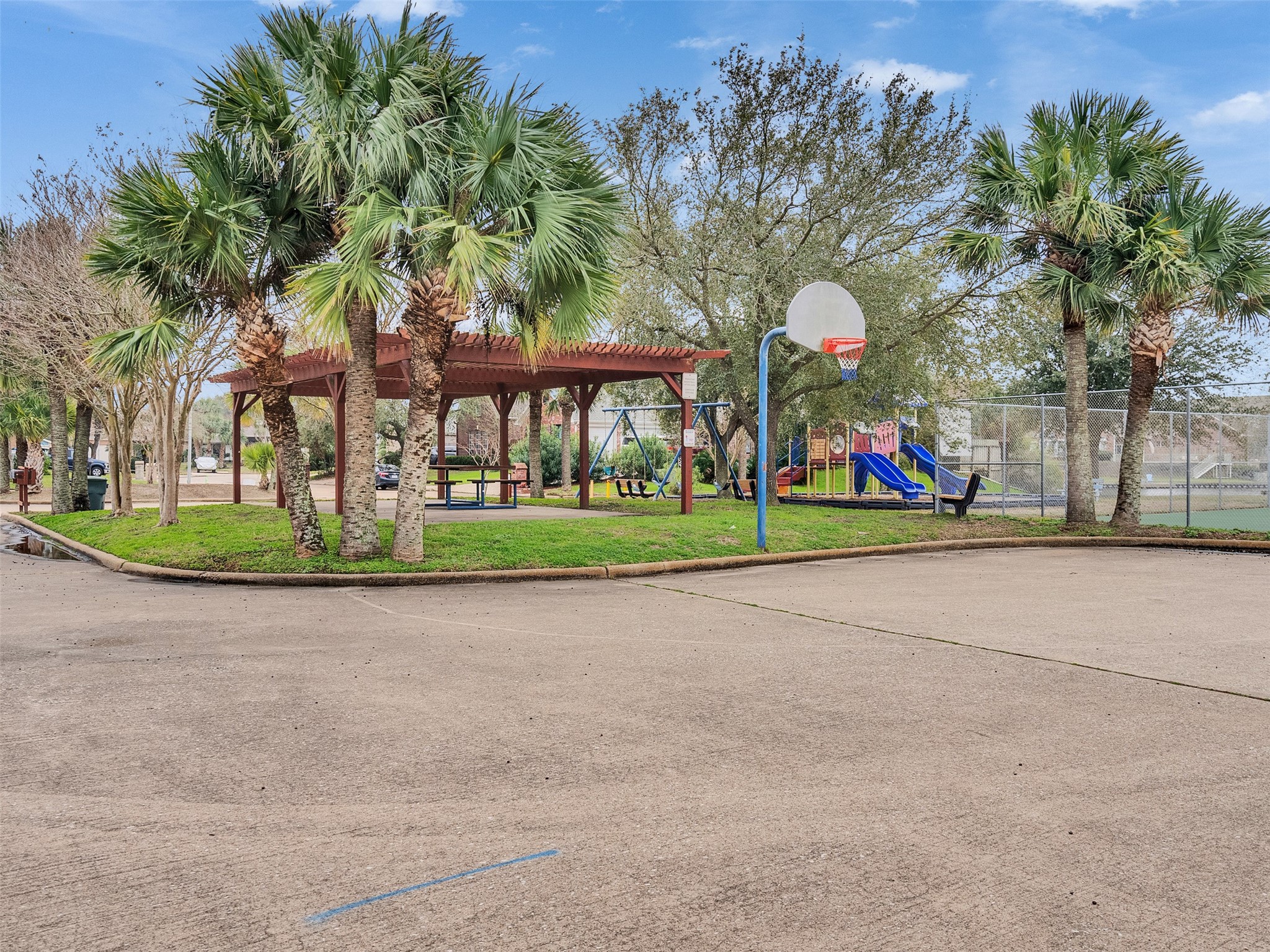 10109 Schaper Road Galveston, TX 77554 - Photo 31 of 33 Enjoy peaceful green space just steps away at the COMMUNITY PARK, ideal for relaxing or play.