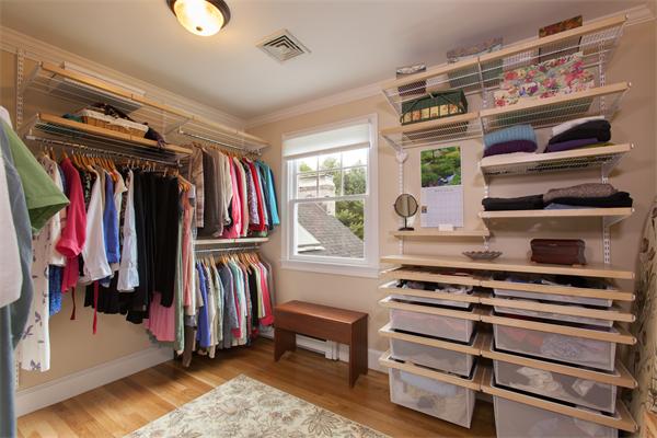 52 MacMillan Drive Concord, MA 01742 - Photo 21 of 23 a view of walk in closet with clothes and shoes