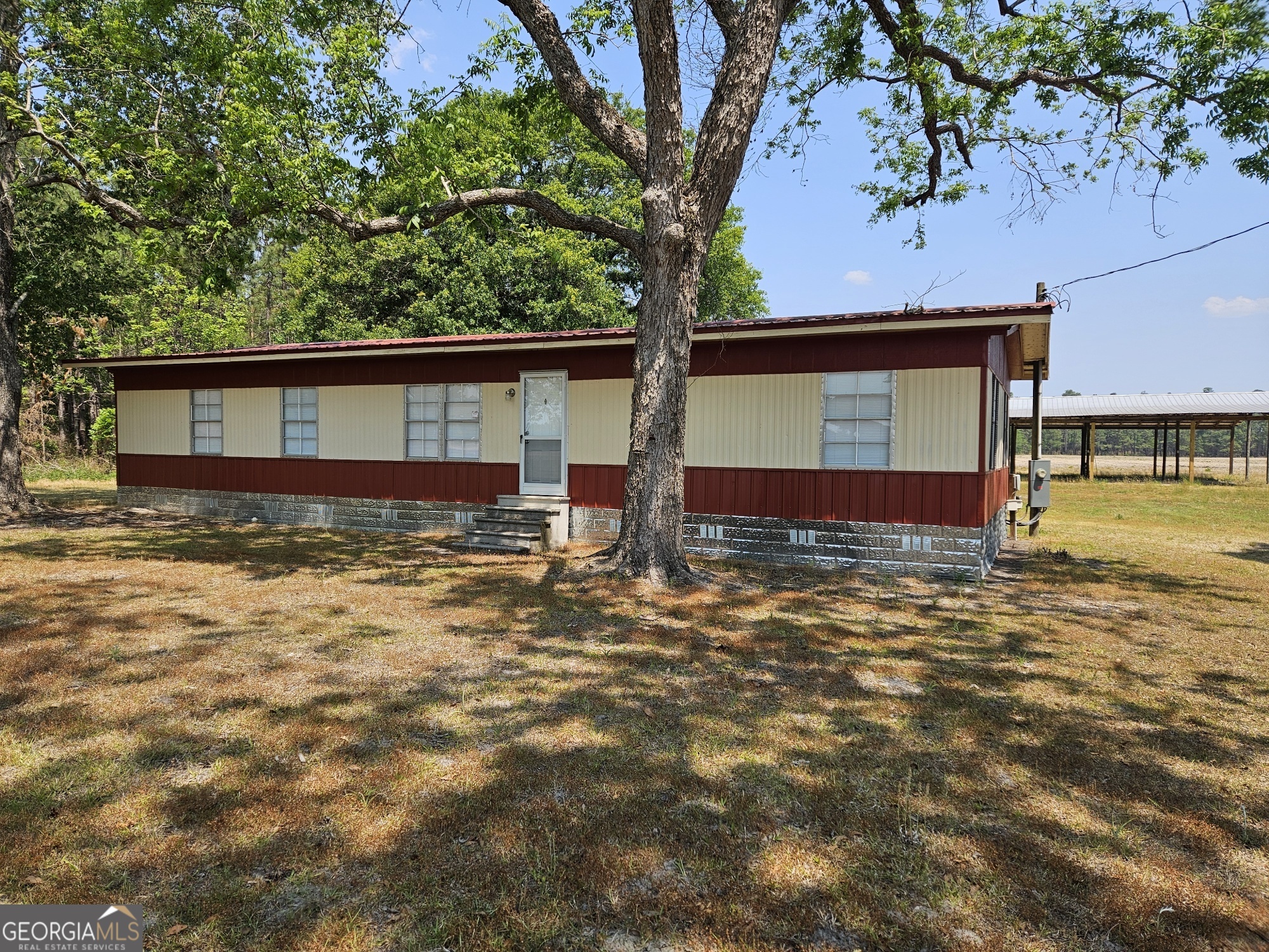647 Buck Creek Road Sylvania, GA 30467 - Photo 16 of 16 a front view of a house with a yard