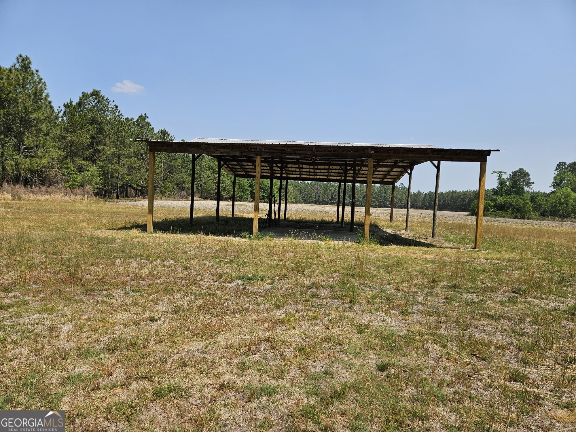 647 Buck Creek Road Sylvania, GA 30467 - Photo 3 of 16 a view of outdoor space with deck and yard