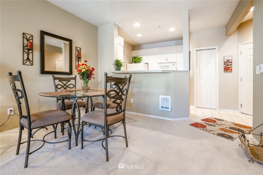 23908 Bothell Everett Highway, Unit A103 Bothell, WA 98021 - Photo 7 of 20 a dining room with furniture and window