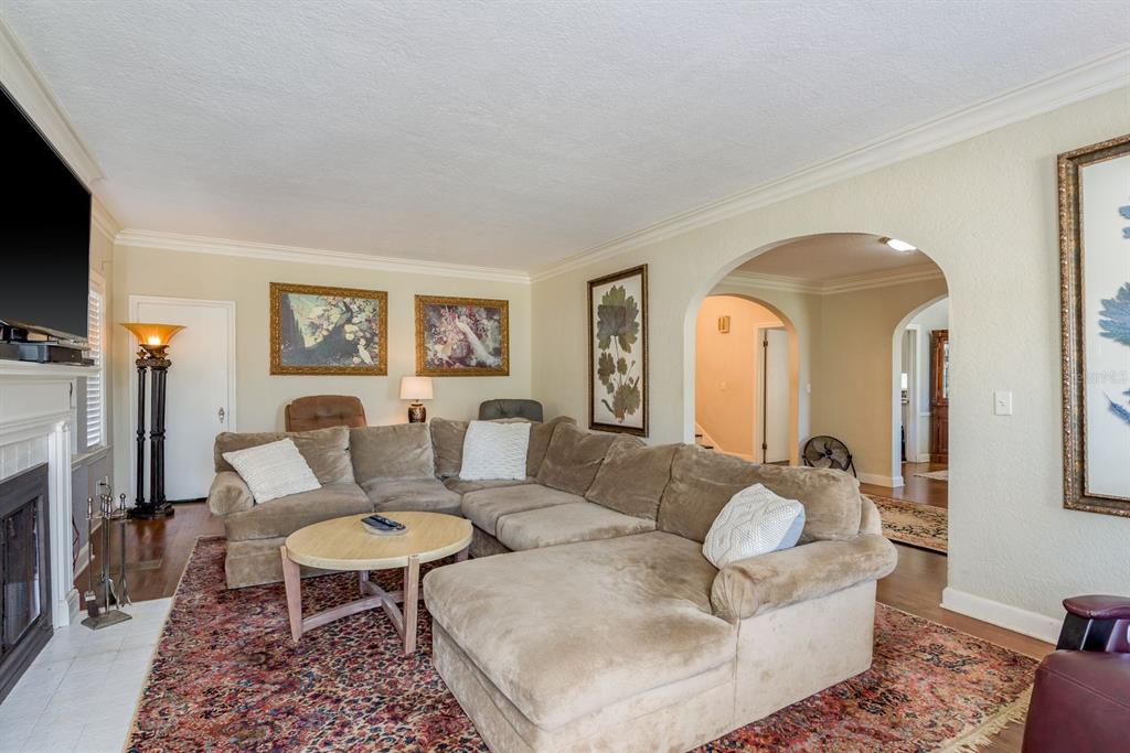 1111 West Line Street Leesburg, FL 34748 - Photo 19 of 77 a living room with furniture and a fireplace