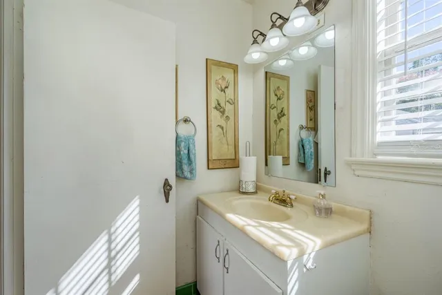 a bathroom with a sink toilet and vanity
