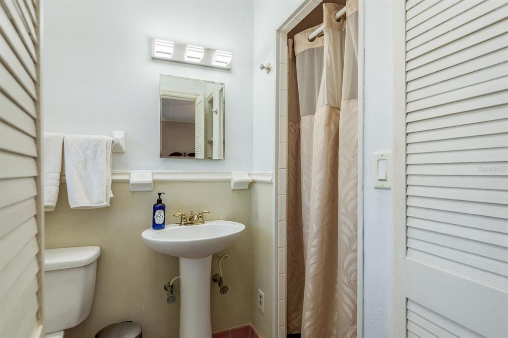 1111 West Line Street Leesburg, FL 34748 - Photo 31 of 77 a bathroom with a sink toilet and mirror