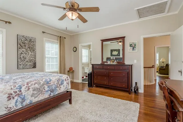 a living room with furniture a flat screen tv and a window
