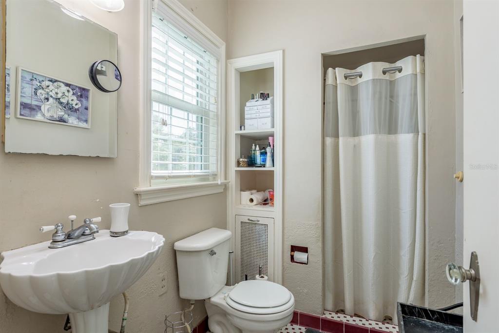 1111 West Line Street Leesburg, FL 34748 - Photo 37 of 77 a bathroom with a sink toilet and shower