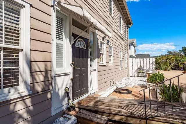 a bedroom with a bed and a tv