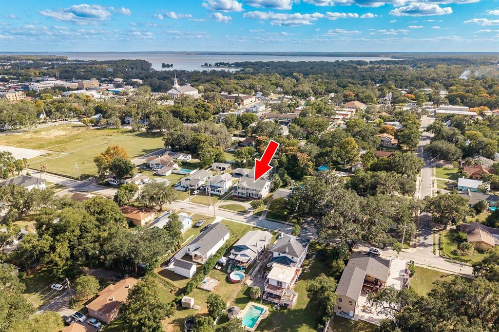 1111 West Line Street Leesburg, FL 34748 - Photo 5 of 77 an aerial view of residential houses with outdoor space