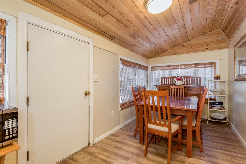 1111 West Line Street Leesburg, FL 34748 - Photo 52 of 77 a view of a dining room with furniture and wooden floor