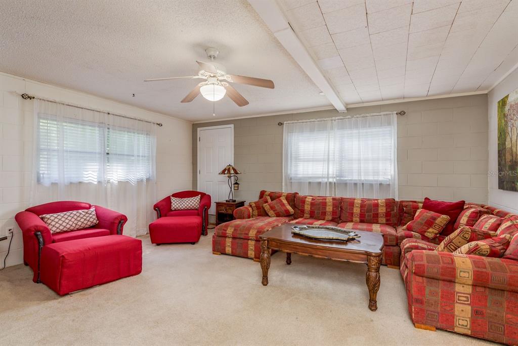 1111 West Line Street Leesburg, FL 34748 - Photo 57 of 77 a living room with furniture and a window