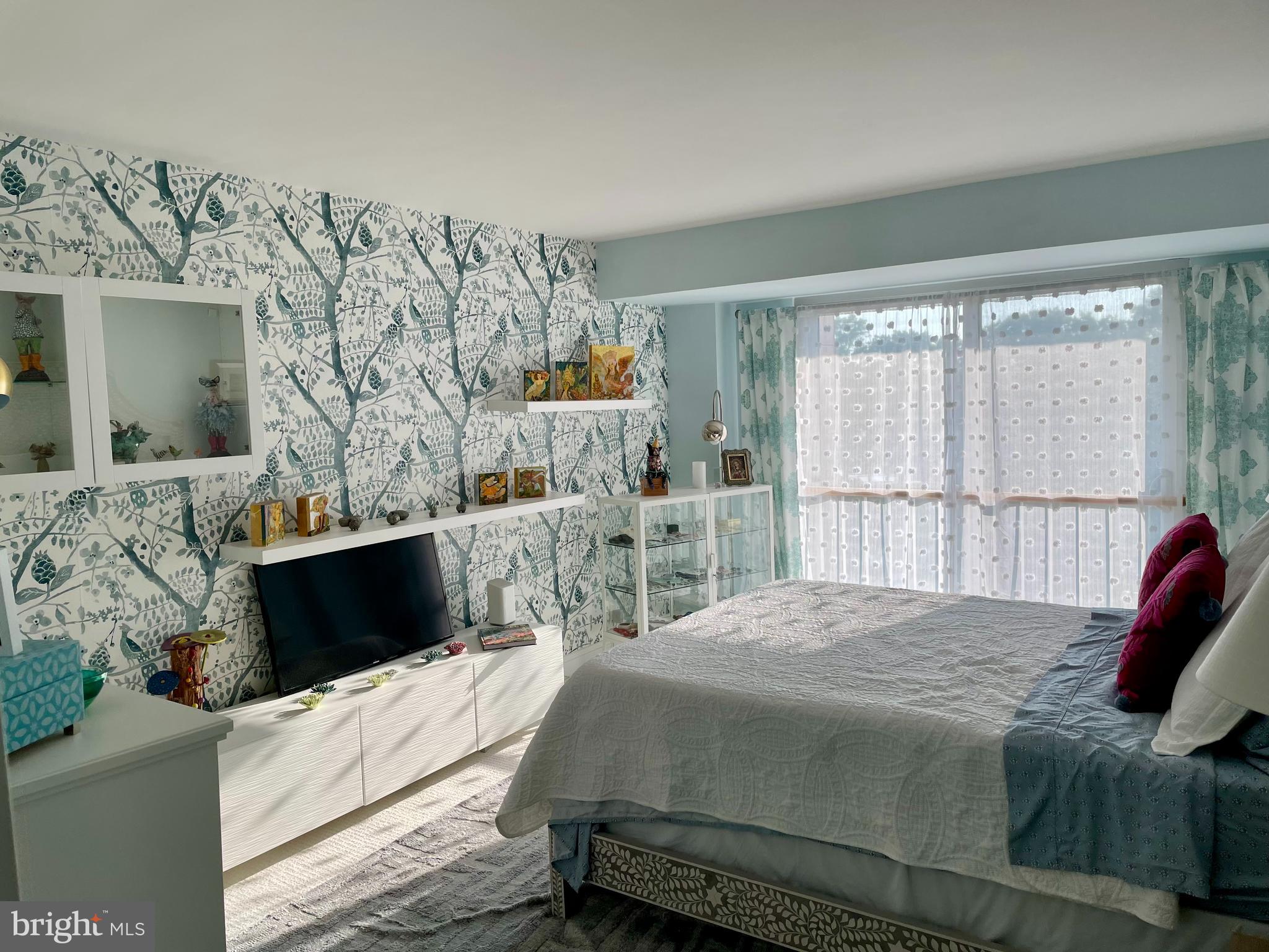 510 N Street Southwest, Unit N526 Washington, DC 20024 - Photo 5 of 9 a bedroom with a bed and a television