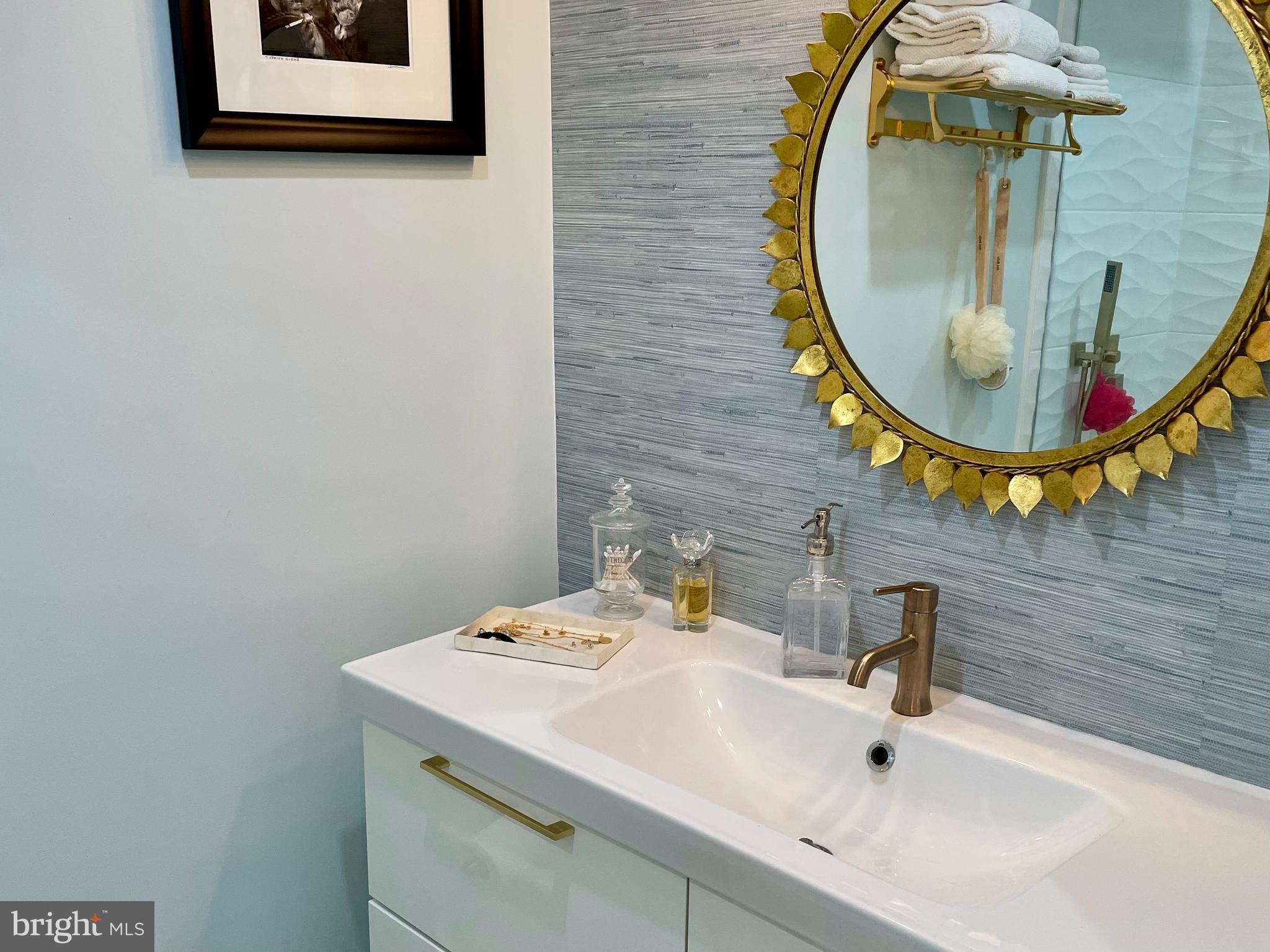 510 N Street Southwest, Unit N526 Washington, DC 20024 - Photo 7 of 9 a bathroom with a sink and a mirror