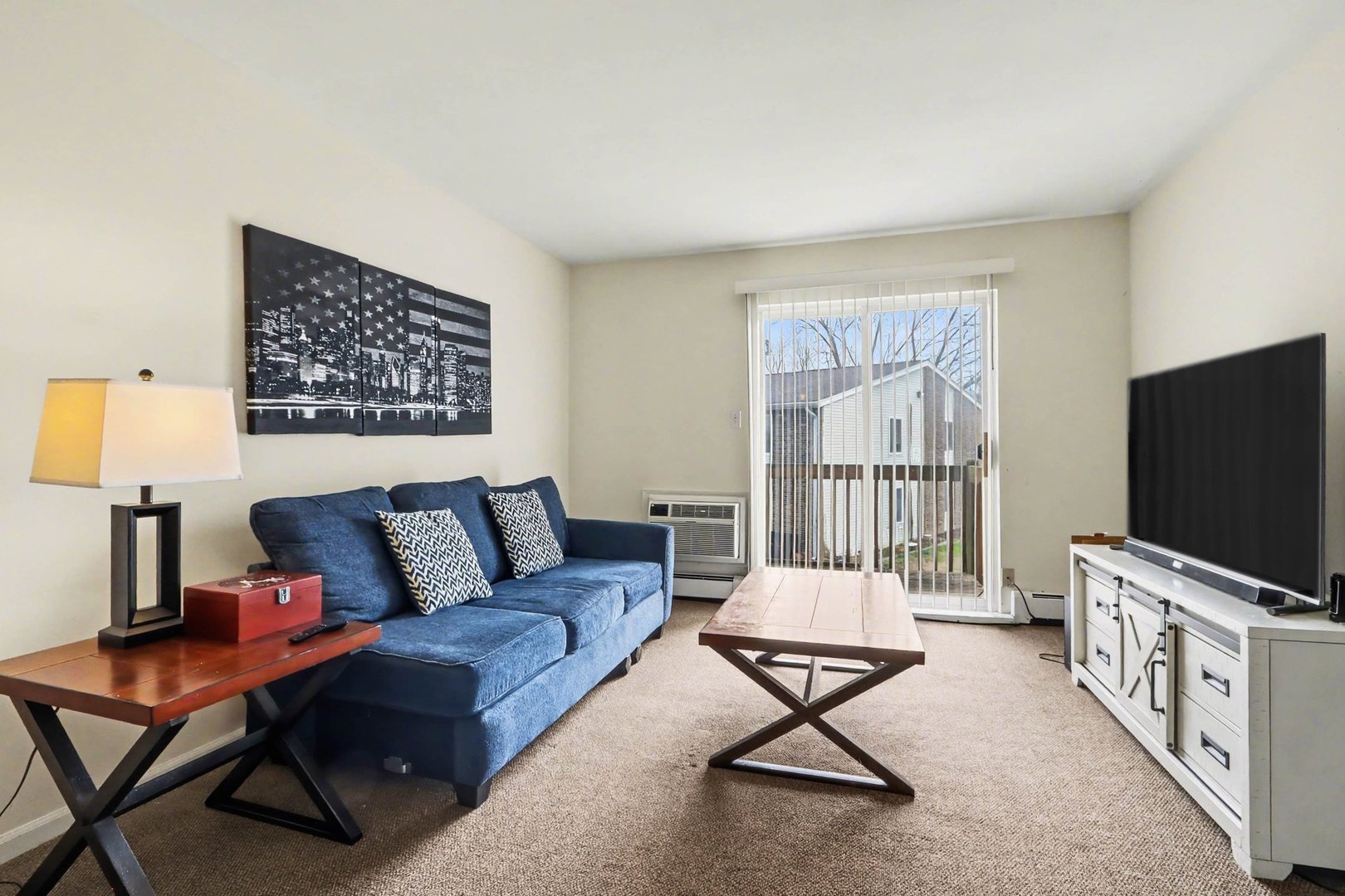 1900 Light Road, Unit 210 Oswego, IL 60543 - Photo 2 of 15 a living room with furniture and a flat screen tv